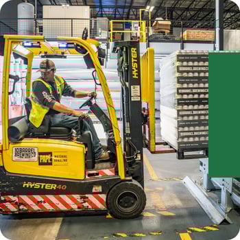 Man using a forklift truck in a supply chain